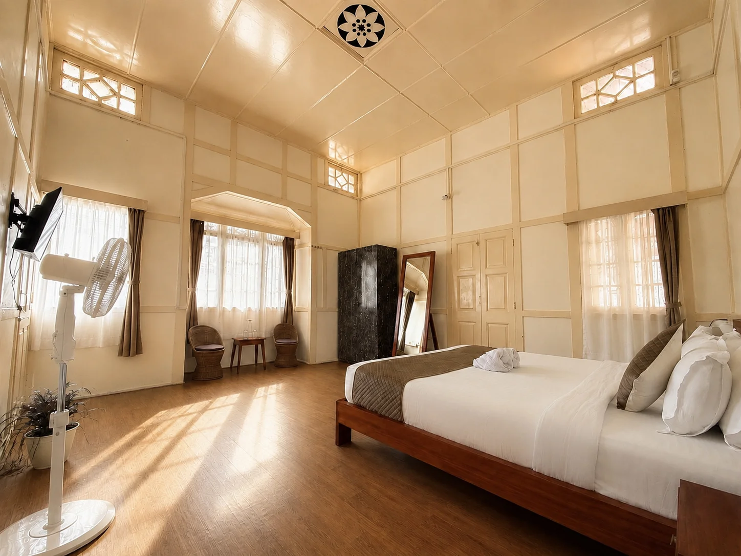 Hometown Glory, a spacious cream room with bay-window seating.