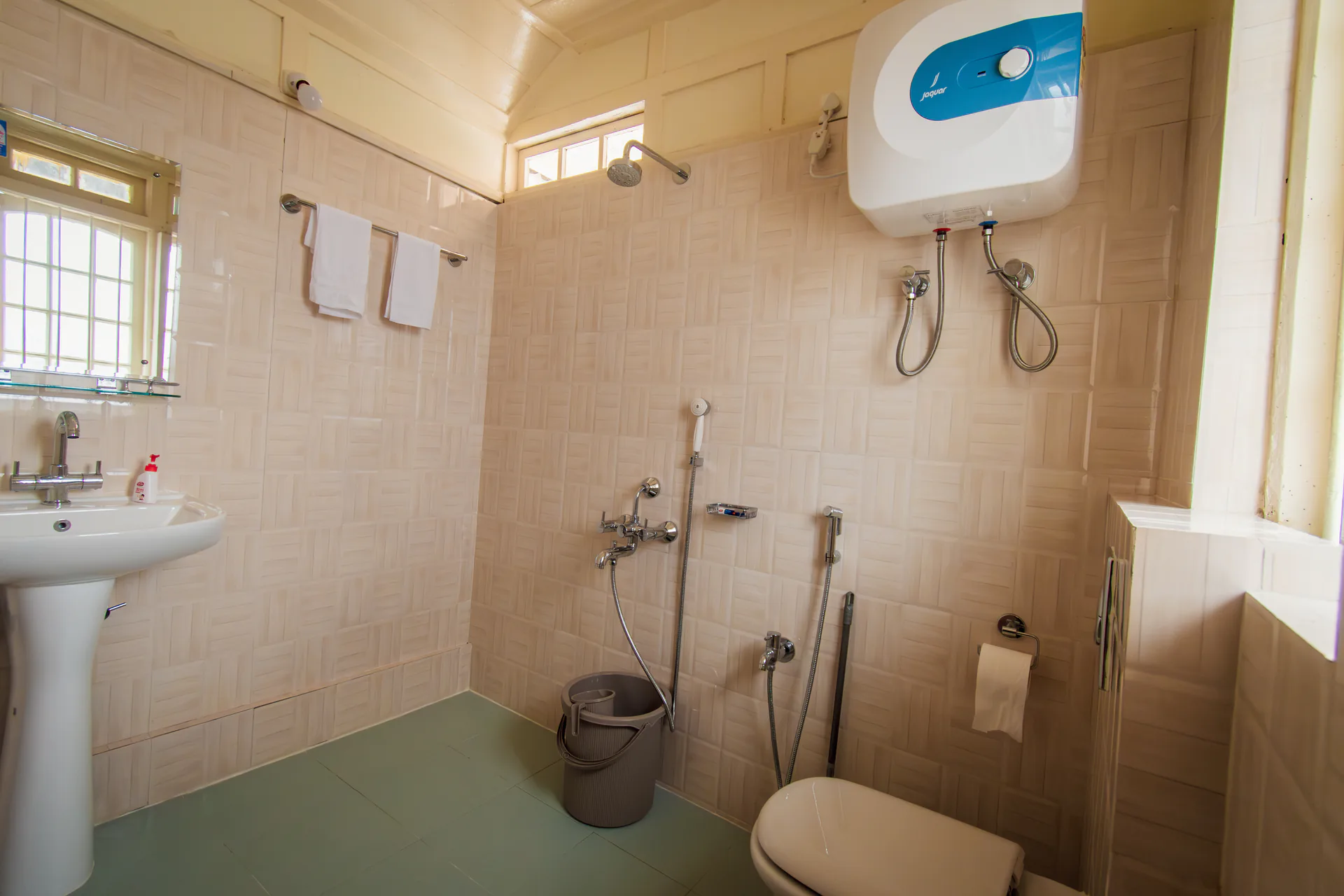 Hometown Glory’s private cream-tiled bathroom.