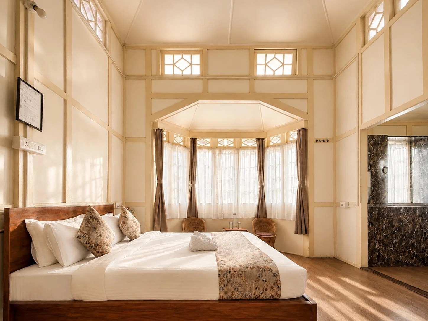Vanilla Twilight’s timber bed facing its bay-window seating.