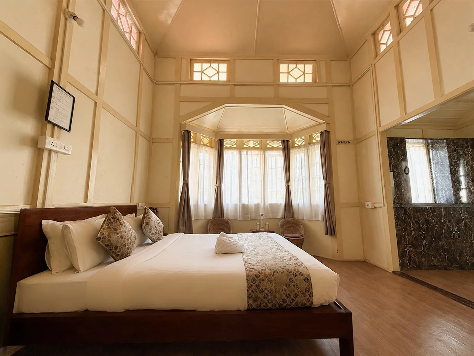 Vanilla Twilight’s timber bed facing its bay-window seating.